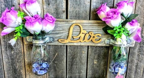 Milk bottle vases hanging on wood