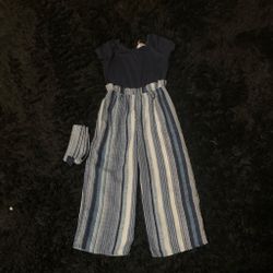 Blue and white striped jumpsuit with blue and white belt