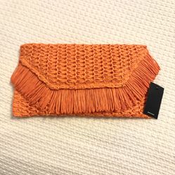 Orange fringed straw clutch bag