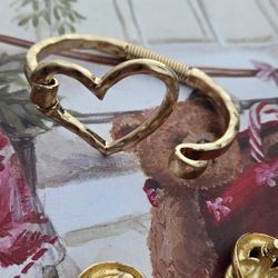 hammered gold-tone open heart hinged bangle. and beautiful earrings