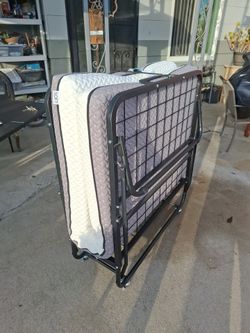 Twin folding bed.