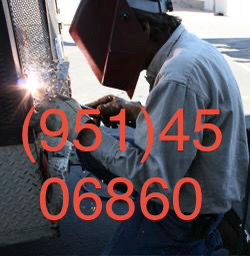 Welder welding gate fence automotive heavy equipment