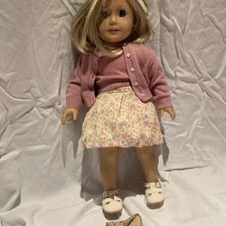 Kit Kitteridge American Girl doll with buffalo nickel in handbag
