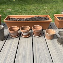 terracotta ceramic pots and saucers