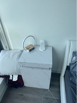 White nightstand with built in outlet and leg light
