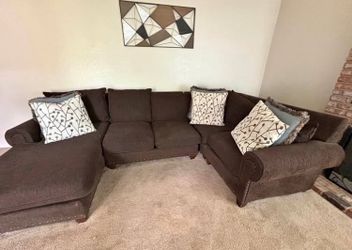 Brown U-shaped sectional couch