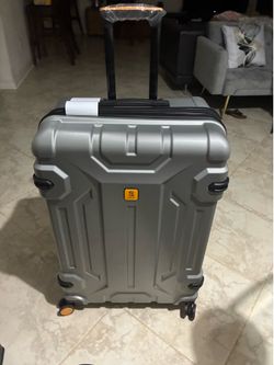 28” silver rolling suitcase brand new