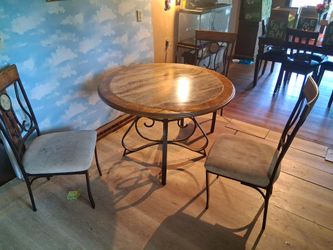 Kitchen table w/ 3 nice chairs.
