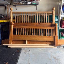 Queen size bed frame with side rails and braces. Solid wood.