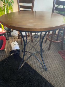 Brown wood table with two chairs good condition
