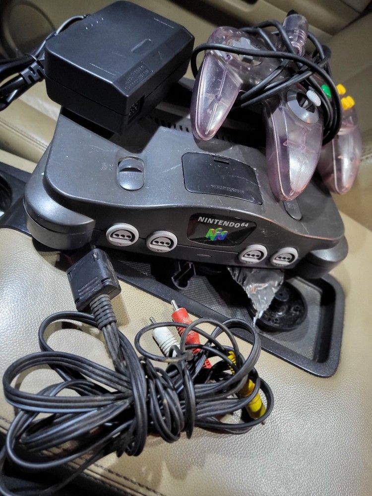 Nintendo 64 system with atomic purple Controller, av cord, and power cord
Working perfectly.
