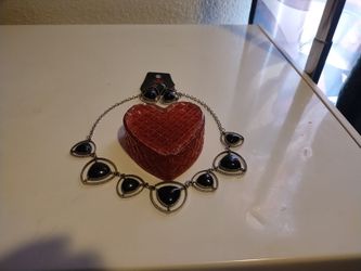 Red Heart Jewelry Box With A Necklace And Earrings