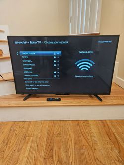 New Cond 43 inches  SHARP TV WITH REMOT CONTROL  , WORKS EXCELLENT  , IN THE BOX K
