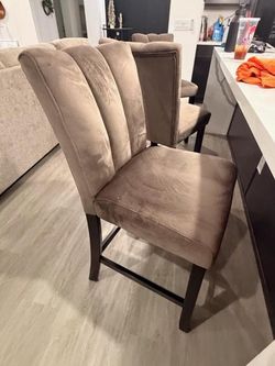 3 suede barstools for sale.
