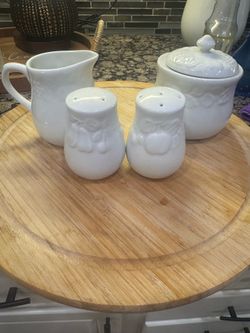 White sugar, cream, salt, and pepper set