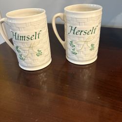 Belleek Pottery Shamrock mugs, specifically the "Himself" and "Herself" designs. 
