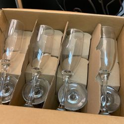 12.5 X 9” X 12” New In The Box 16 Long Stem Champaign Flute Glasses, 12  X 750ML & 4 Smaller 