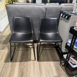 Two West Elm Leather Dining Chairs