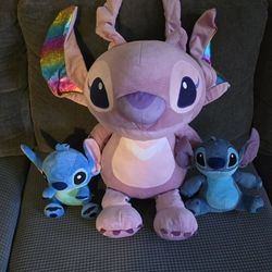 Stitch Plushies. Pink One Is 18 Inches And 2 Blue Are 8 Inches 