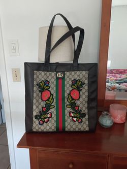Tote customized with Ace sneaker floral patch .