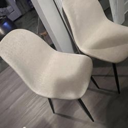 2 cream linen chairs