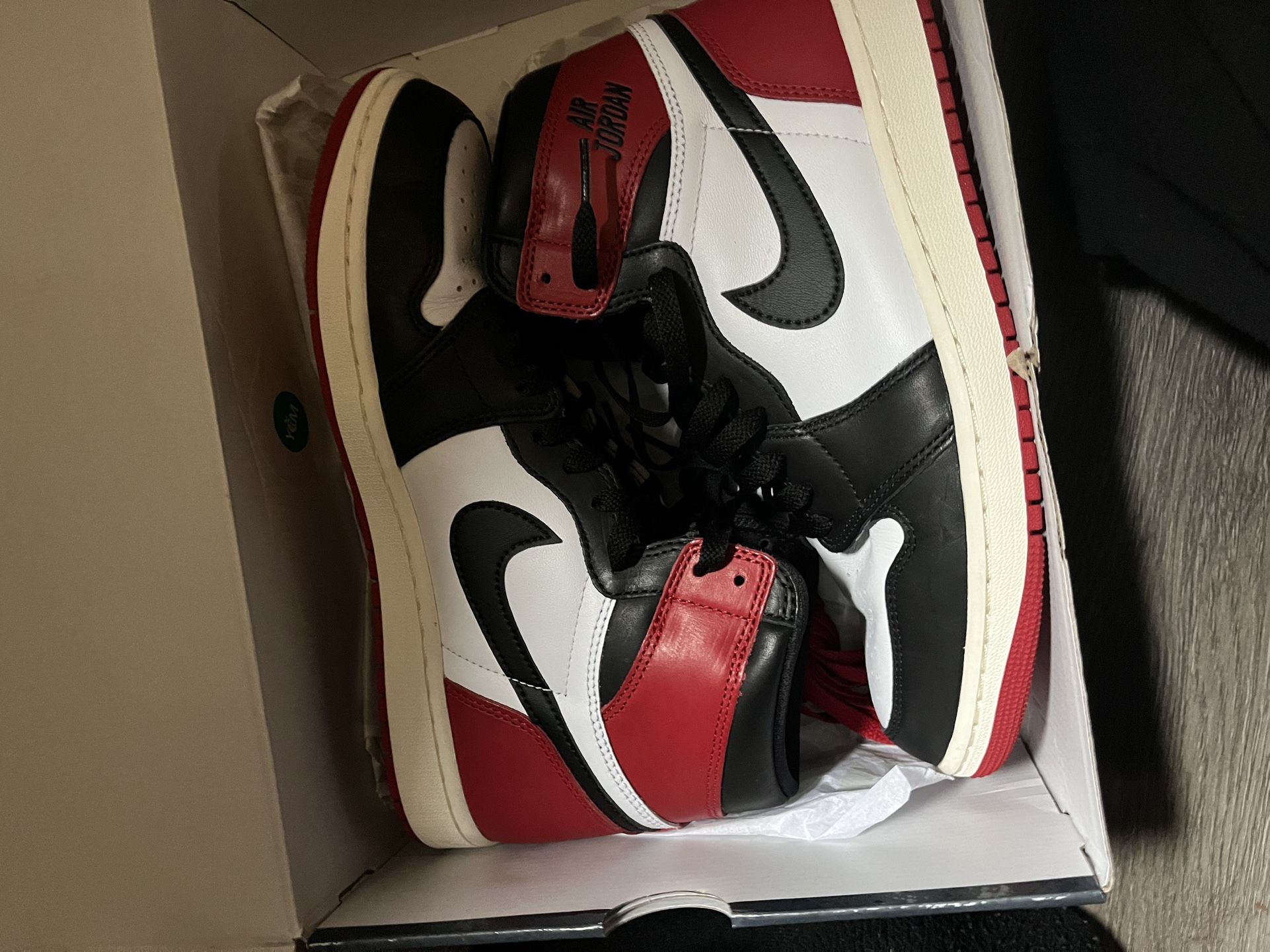 Air Jordan 1 Retro High OG "Black Toe Reimagined".  