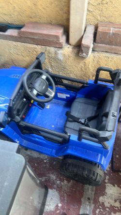 Blue electric ride and toy car