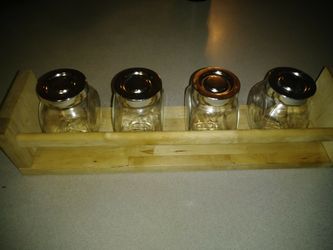 New spice rack with 4 jars. 13.00$