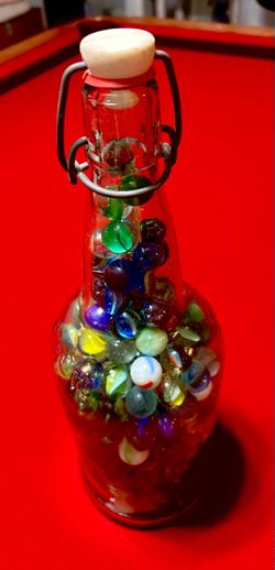 Glass Bottle Filled with Colorful Marbles