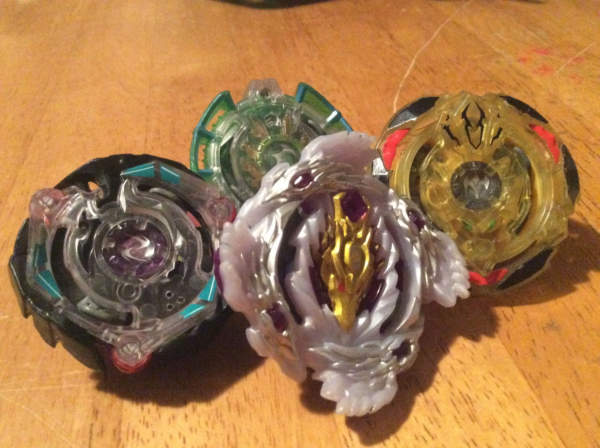 Four beyblades. Brutal luinor,kinetic satomb, spiral treptune,epic evipero. All hasbro 20$
