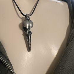Metal bird skull pendant