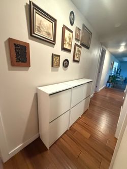 3 white IKEA BISSA Shoe cabinet with 2 compartments