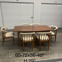 Antique solid wood dining table with 6 chairs.