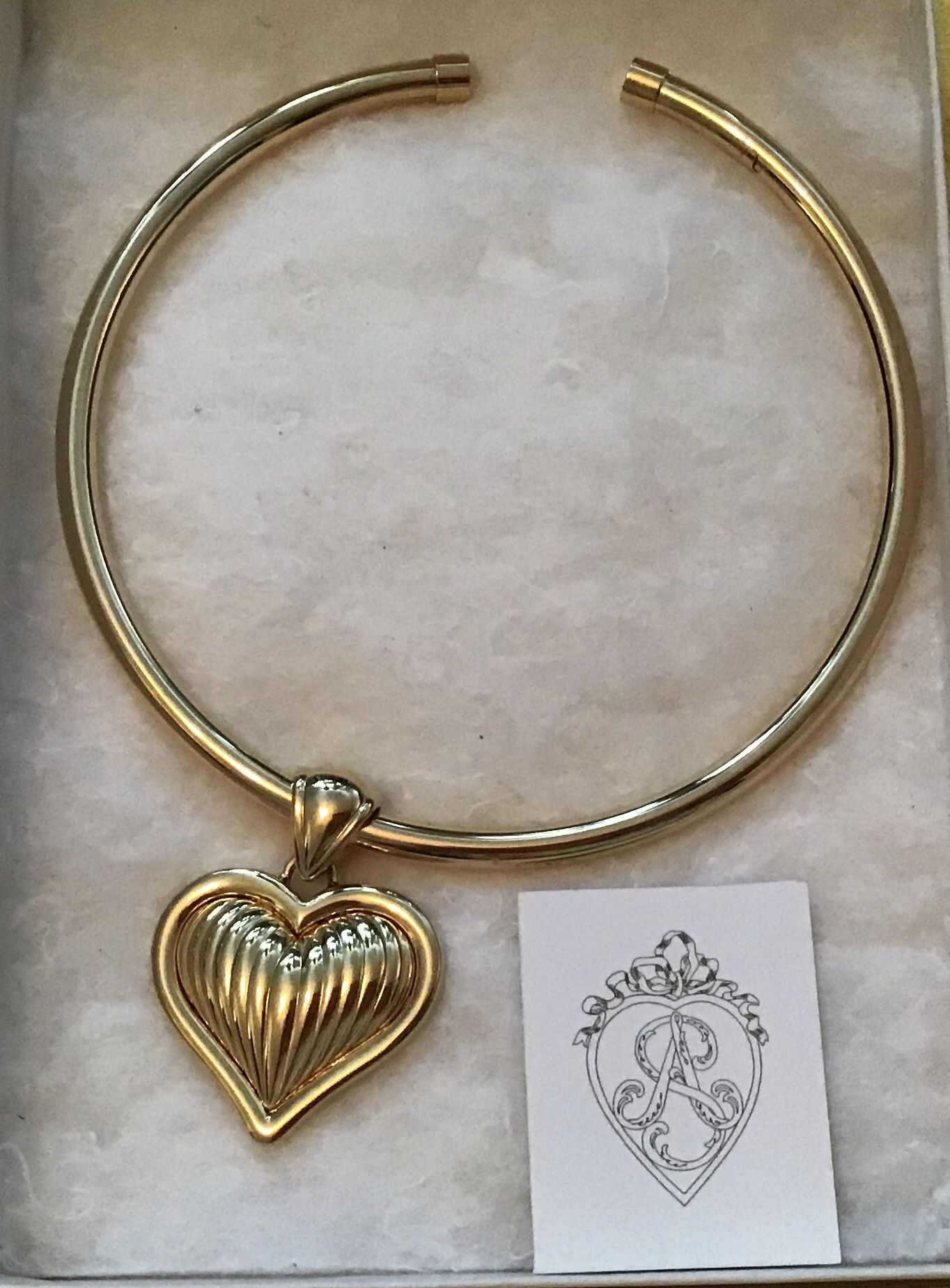 Gorgeous necklace. Double sided heart. This would make a lovely gift. Brand new. Never worn