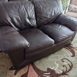 Dark brown real leather sofa, and love seat.