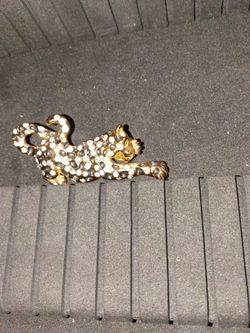 Roman gold toned leopard brooch