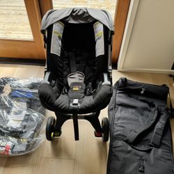 Doona Car Seat and Stroller All-in-One Greyhound and Base and Travel Bag
