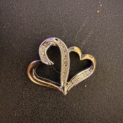 **SS925** refers to **sterling silver that is 92.5% pure silver**, And Gold. With Diamond Double Heart