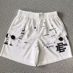 EE basketball shorts, white and black
