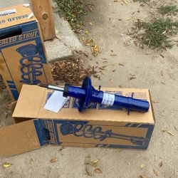 A Pair Of Front Struts For A 2001 Vw Beetle