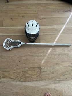 Lacrosse helmet and offense stick