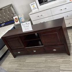 Floor model Brown TV stand only $299. Easy finance option. Same-day delivery or pick up.