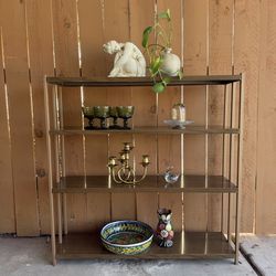 Vintage four tier metal bookcase with faux walnut shelves.