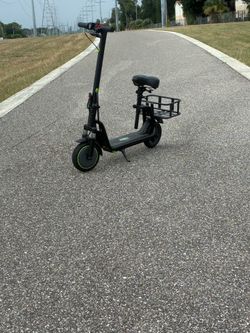 Electric scooter includes charger