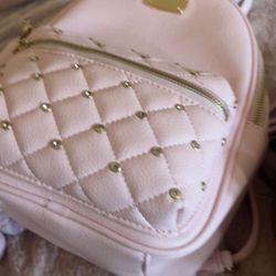 a pink mini Backpack 