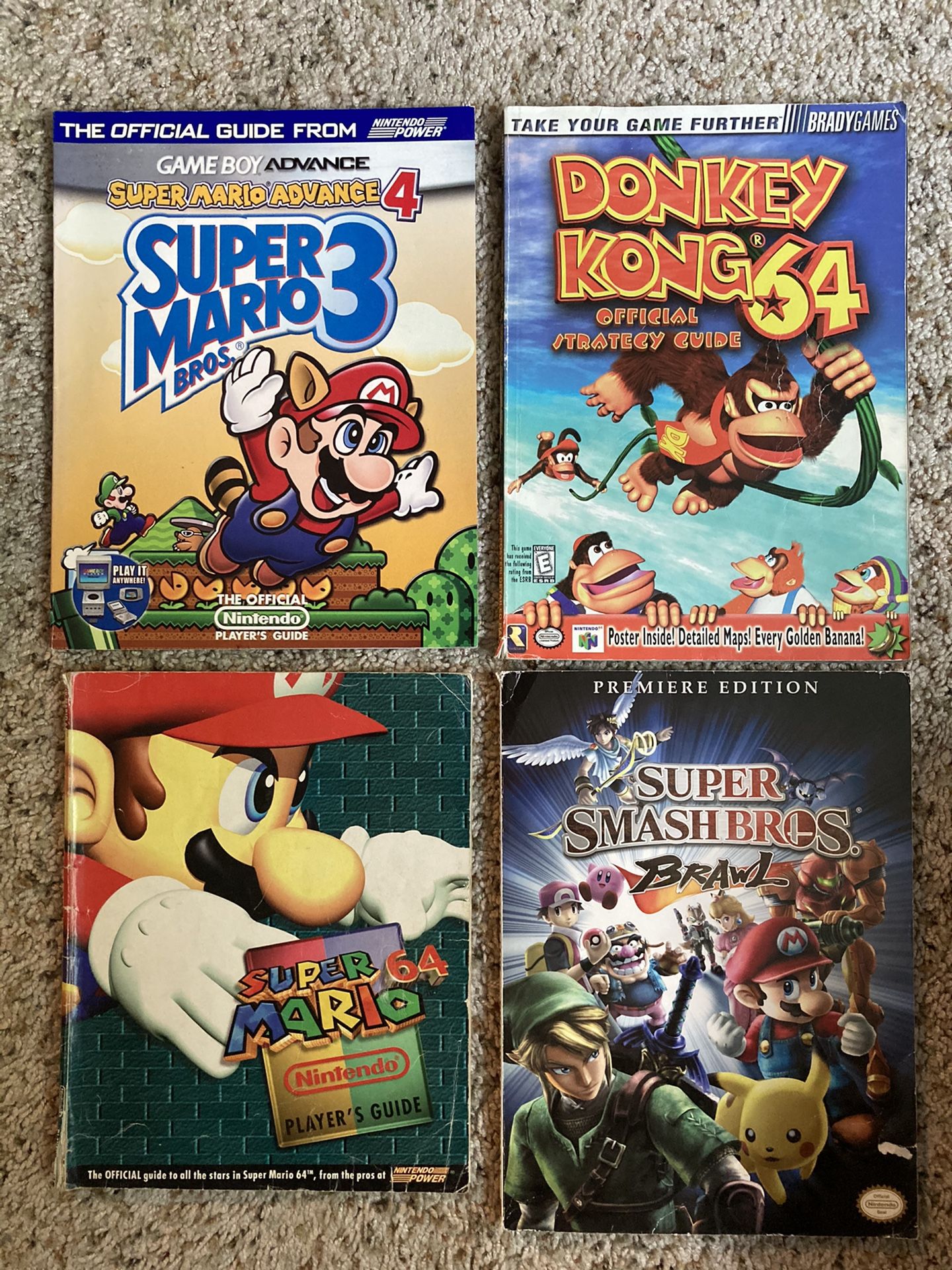 Nintendo Strategy Guides for Mario 64, Donkey Kong 64, Super Mario 3, and Smash Brawl