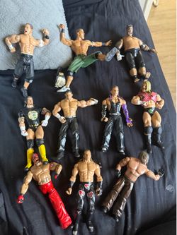 WWE wrestling figure bundle lot. Includes John Cena, CM Punk, Jeff Hardy, Rey Mysterio, Randy Orton and more. Figures are loose and sold as-is. Great 