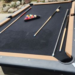 Pool Table With Sticks And Pool Balls