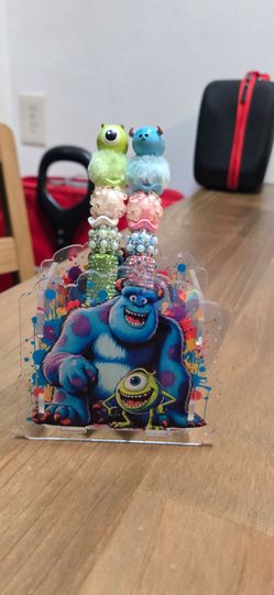 2 pen monsters and 1 pen holder
