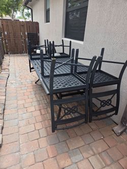 Back yard table set. Includes 4 chairs. Originally $2220